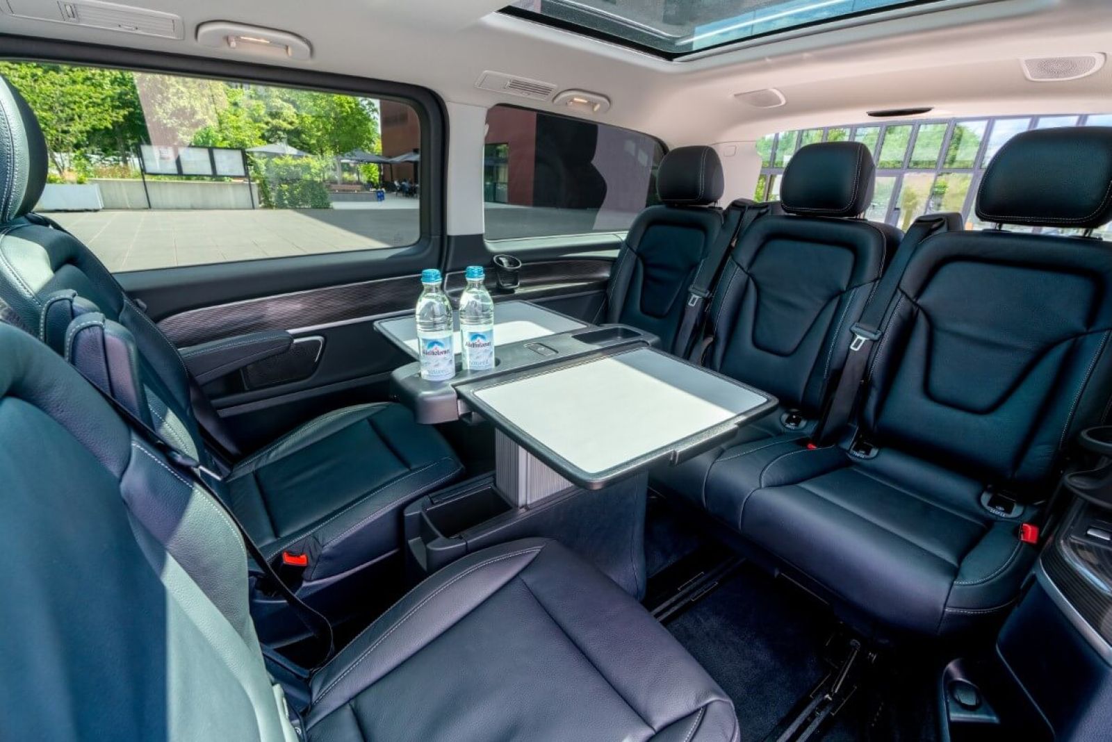 Minivan Mercedes V250d 4matic interior back with working tables.